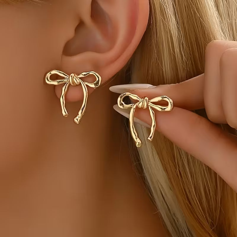 Par de pendientes elegantes con lazo de cinta