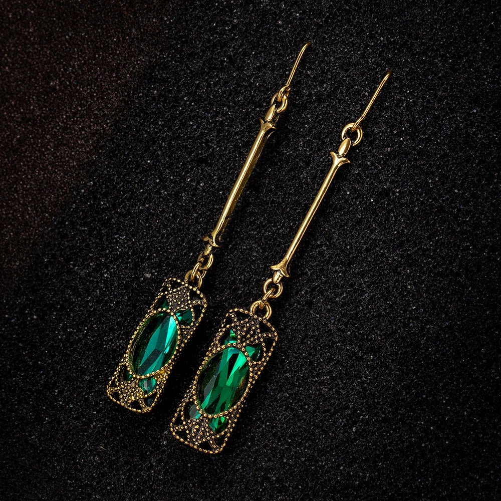 Pendientes dorados con colgante verde