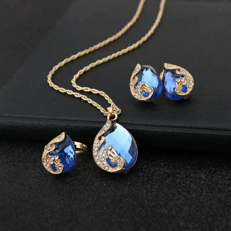 Conjunto de collar y pendientes de cristal azul con dorado