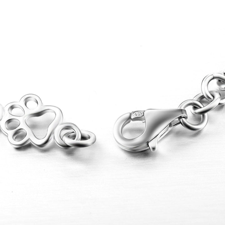 Pulsera con Colgantes de Pata de Perro y Hueso en Plata Pura