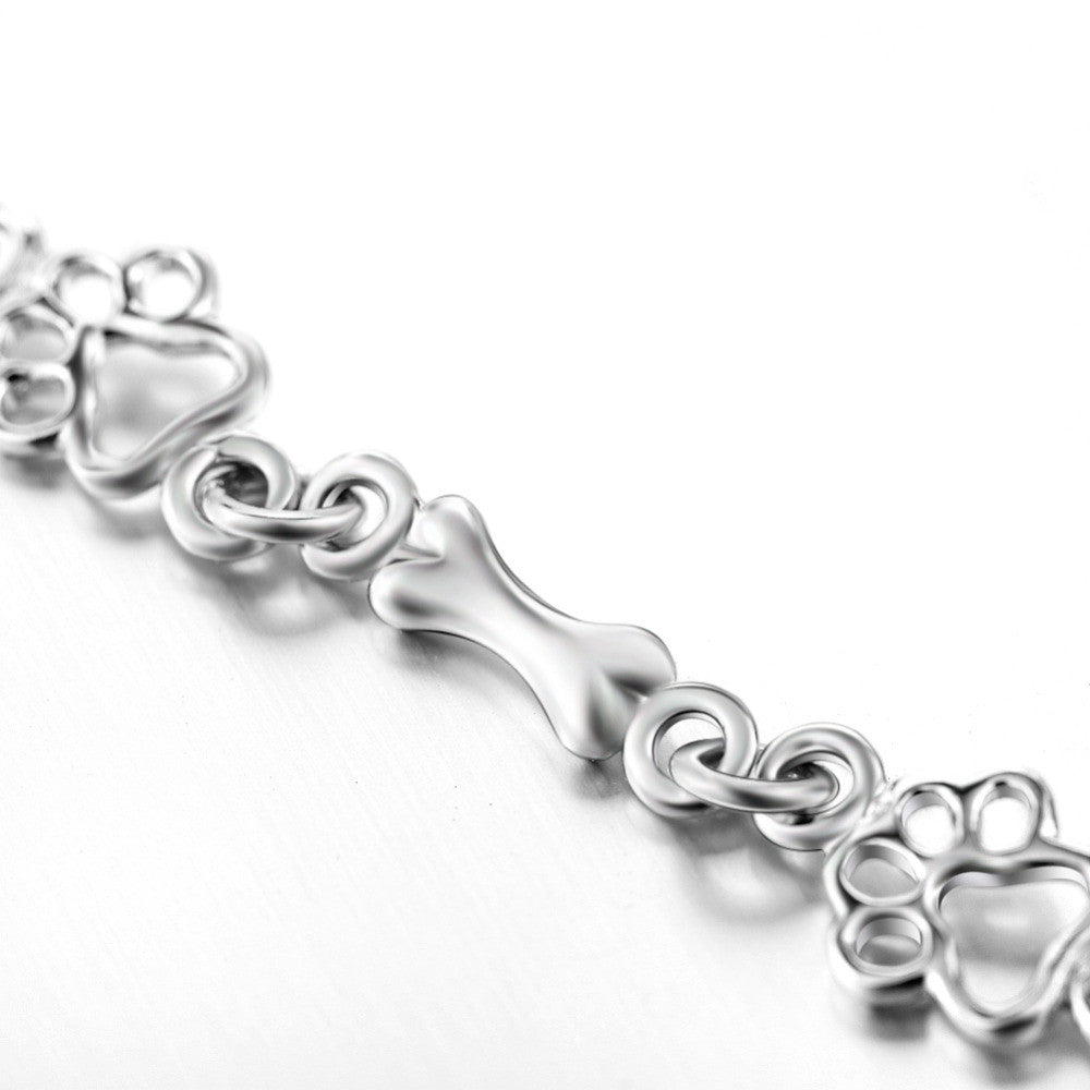 Pulsera con Colgantes de Pata de Perro y Hueso en Plata Pura
