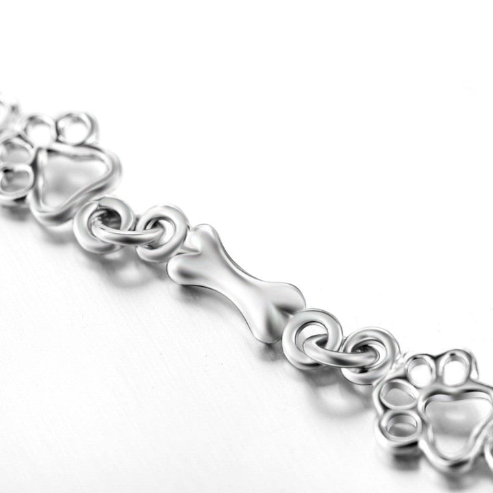 Pulsera con Colgantes de Pata de Perro y Hueso en Plata Pura