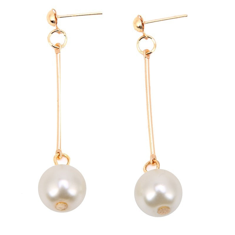 Pendientes colgantes de lujo con perlas especiales colocadas a mano