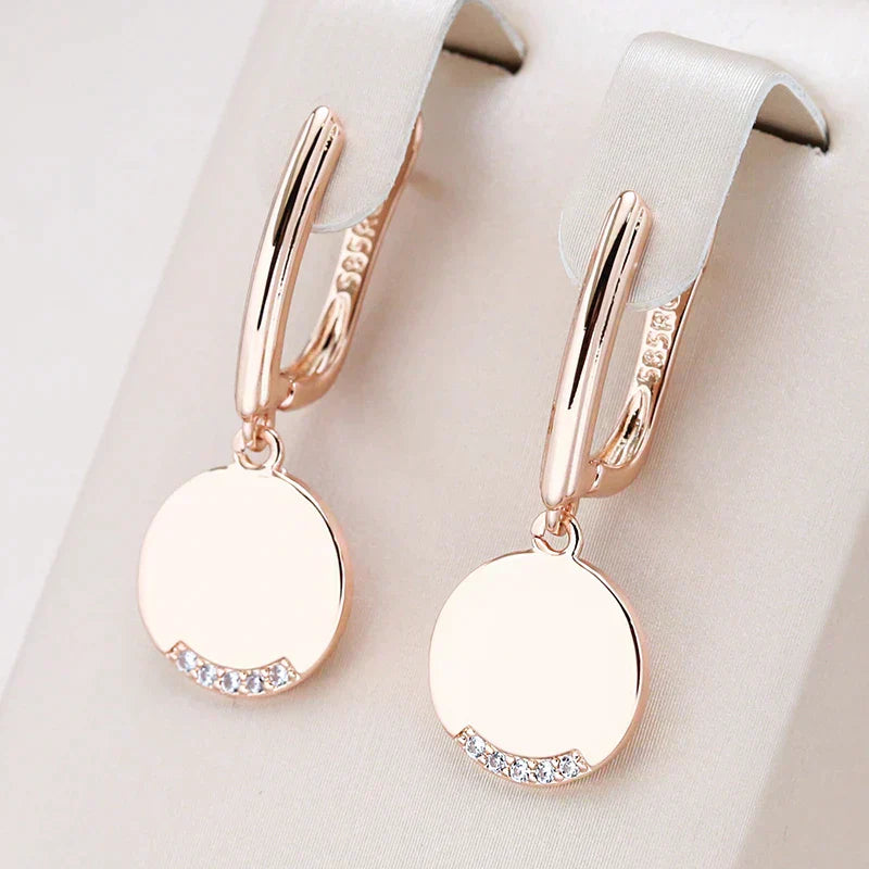 Elegantes pendientes redondos de oro