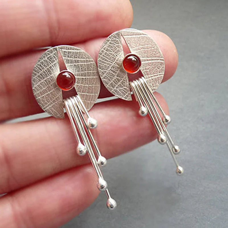 Pendientes colgantes con piedra roja hueca