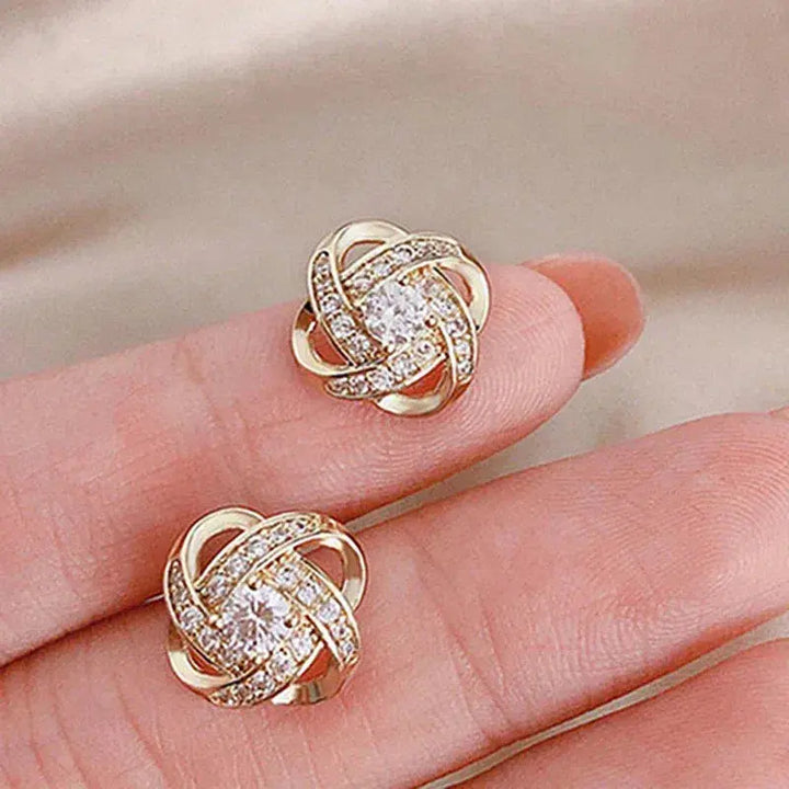 Pendientes cruzados en espiral de flor