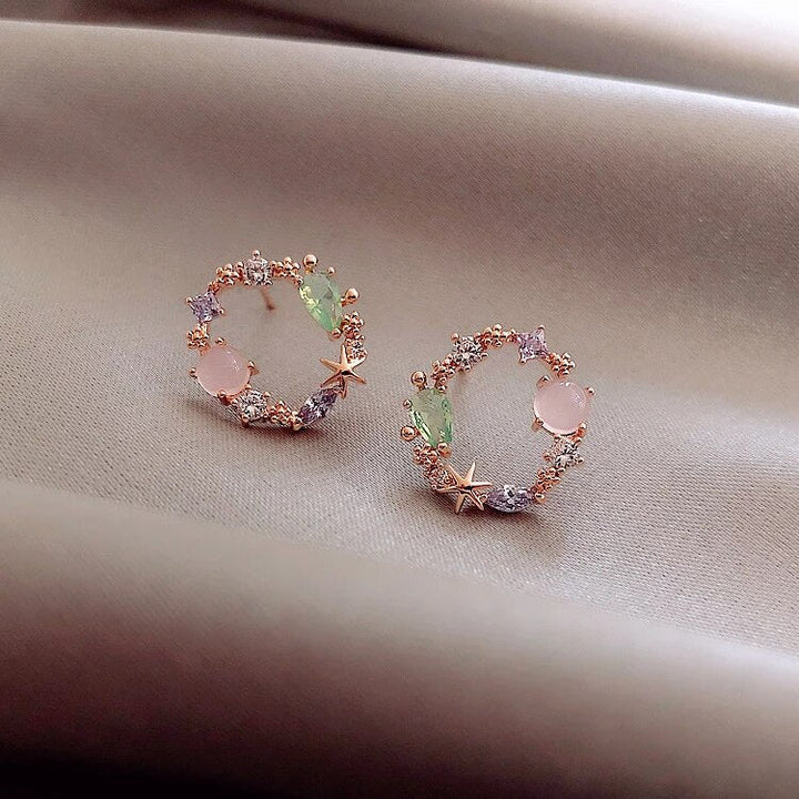 Floral con circonita en oro