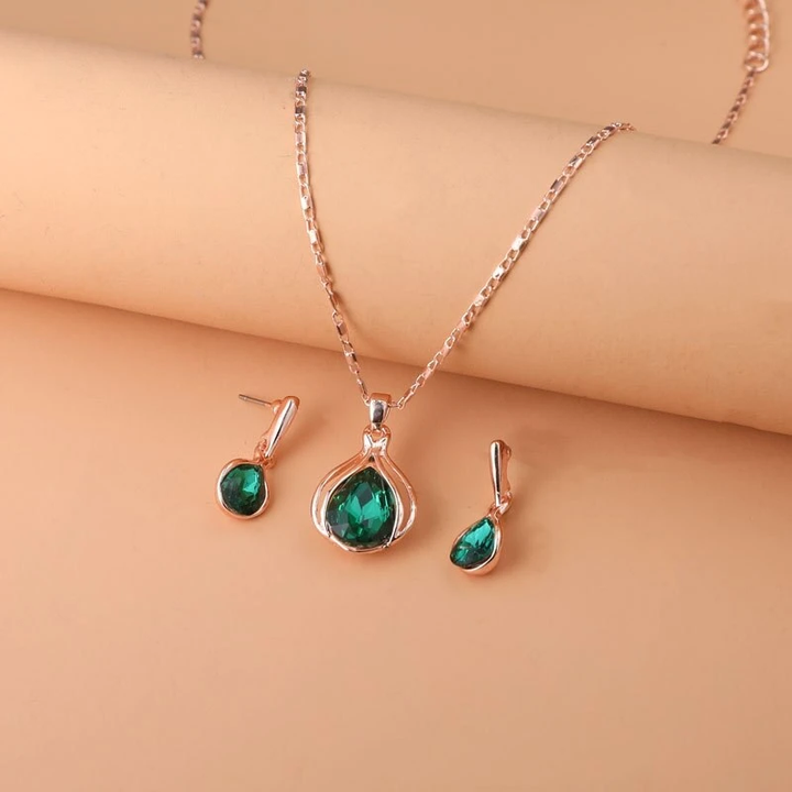 Conjunto de collar y pendientes en cristal verde y oro