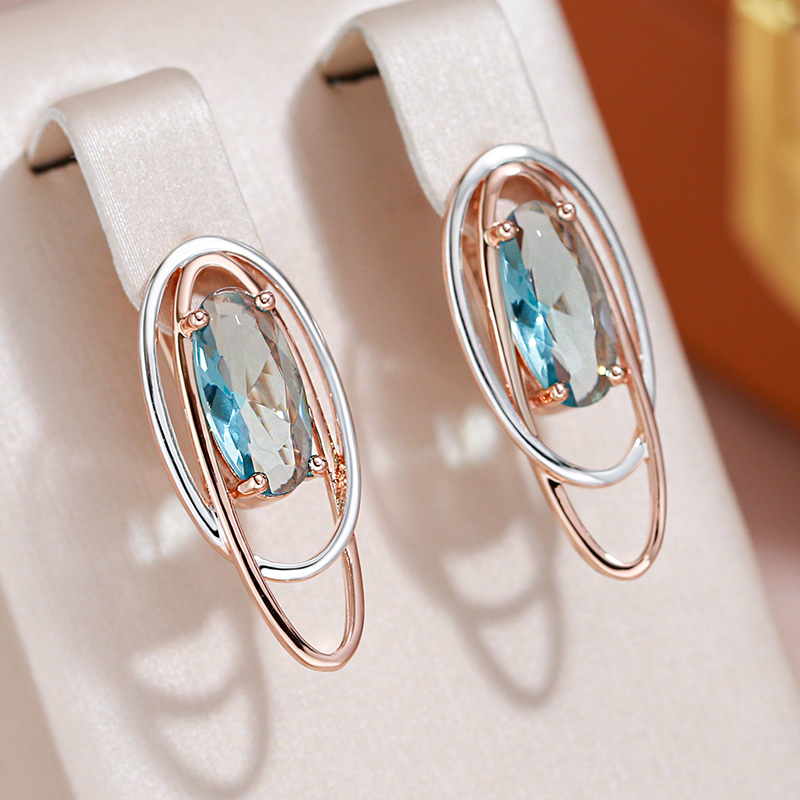 Elegantes pendientes con cristal turquesa en oro y plata