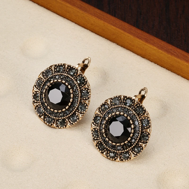 Elegantes pendientes redondos de cristal negro