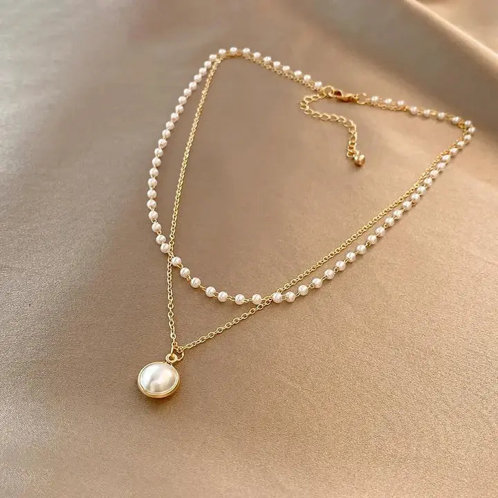Elegante collar de perlas en oro