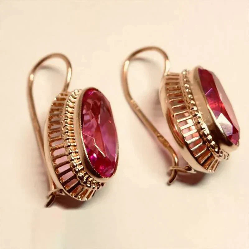 Pendientes en oro rosa con piedras rojas
