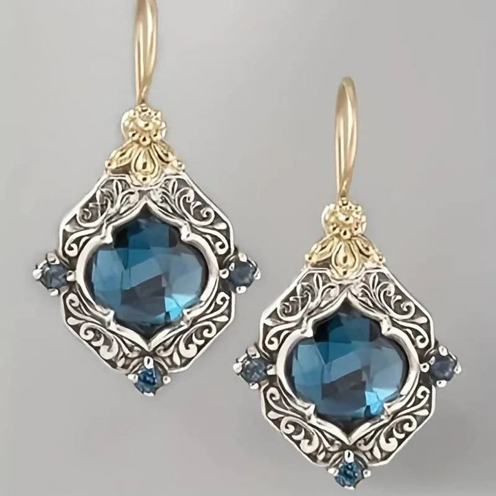 Pendientes de cristal azul en oro y plata