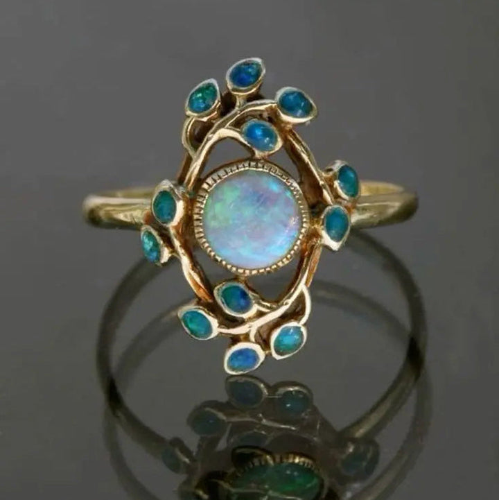 Anillo azul vintage con cristales y ópalo