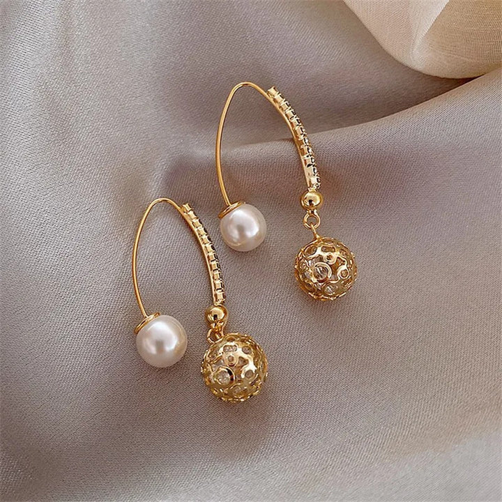 Pendientes colgantes vintage en oro y perlas